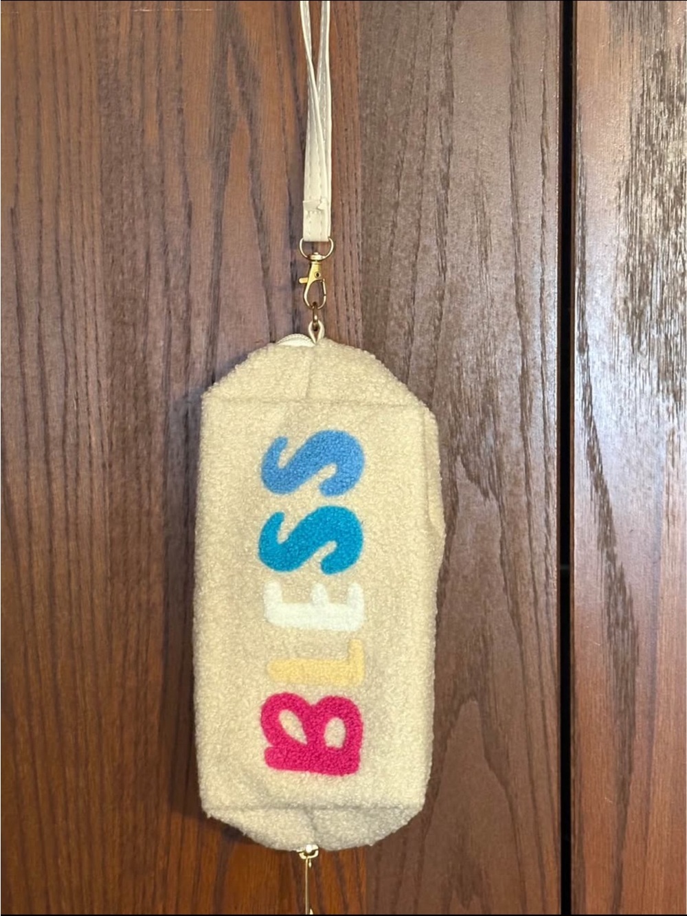 Beige Sherpa Wristlet with Colorful 'BLESS' Lettering